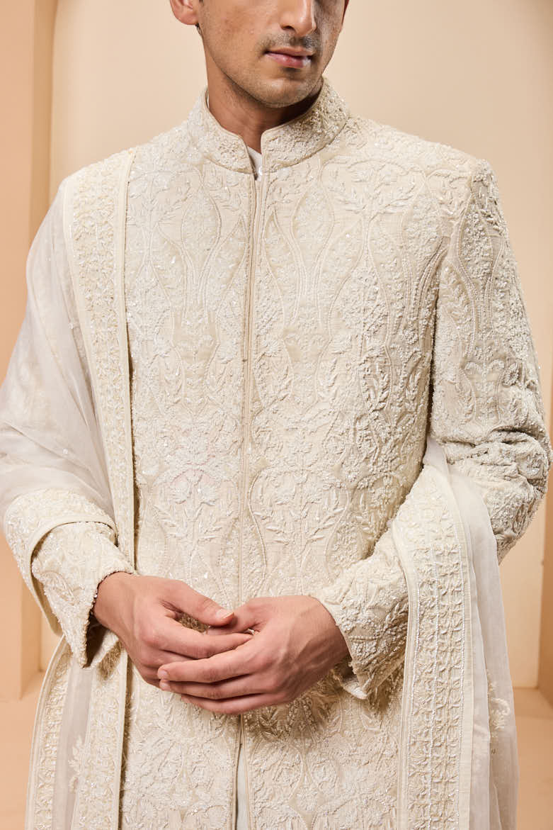 Ivory sherwani detailing with pearl,sequins and aplic work