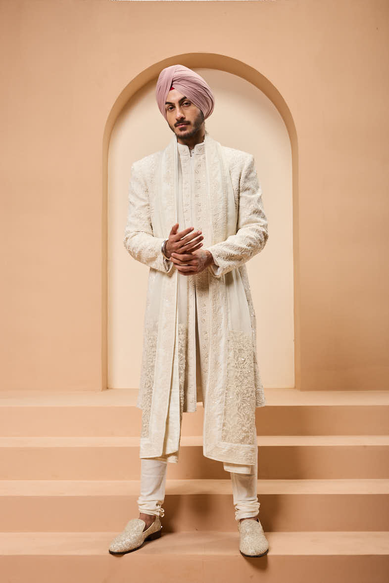 Ivory sherwani detailing with pearl,sequins and thread work