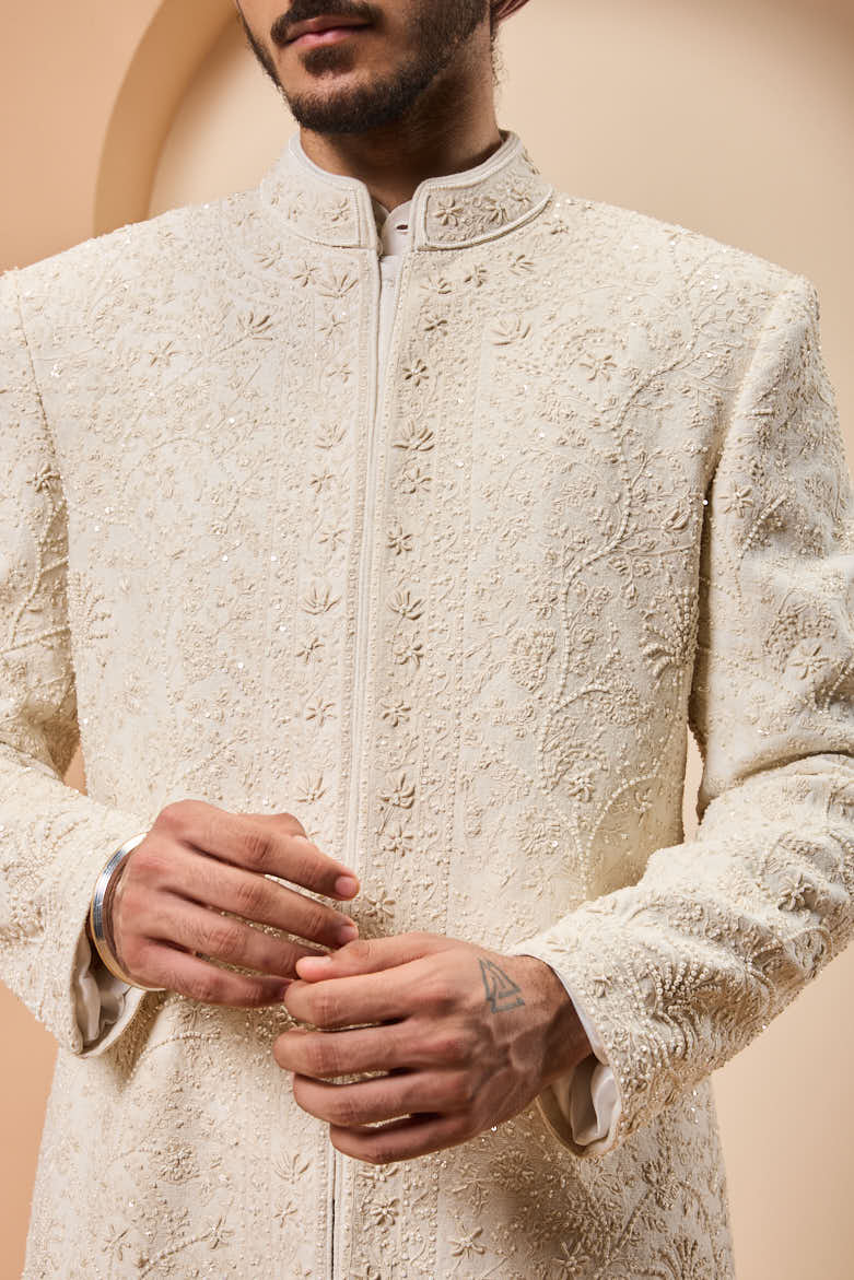 Ivory sherwani detailing with pearl,sequins and thread work