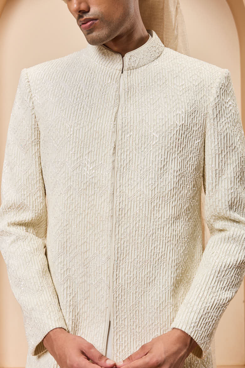 Ivory sherwani detailing with pearl,sequins and thread work