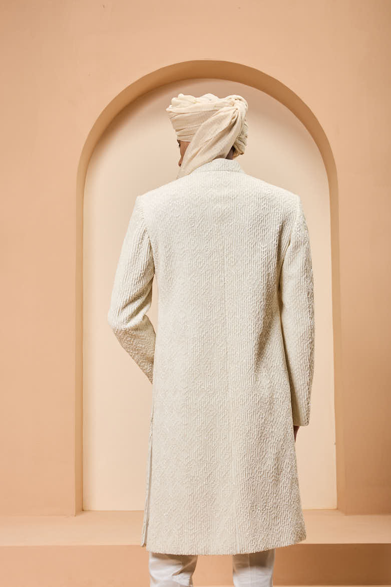 Ivory sherwani detailing with pearl,sequins and thread work