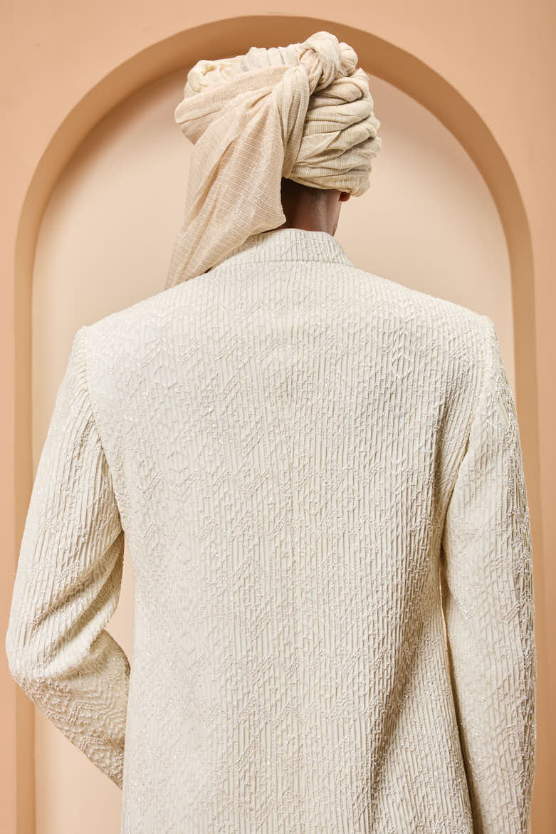 Ivory sherwani detailing with pearl,sequins and thread work