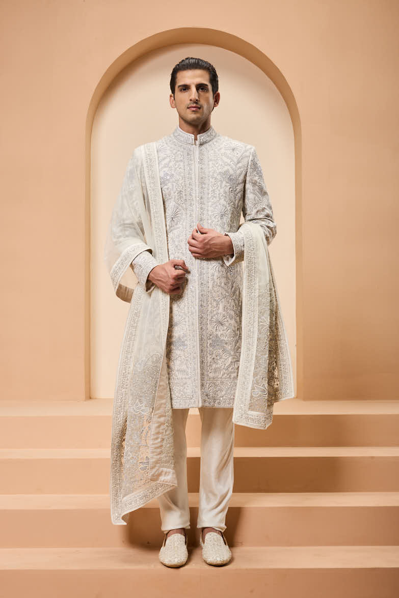 Ivory sherwani detailing with silver zari,pearl,sequins and thread work
