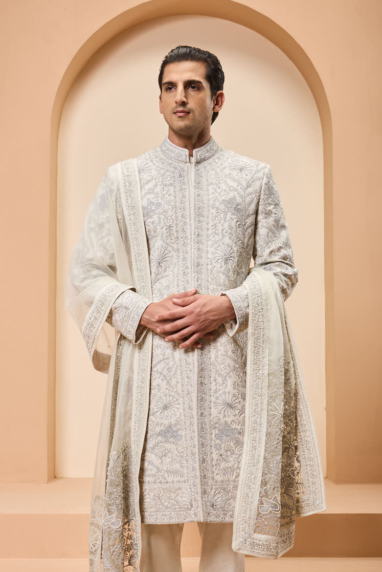Ivory sherwani detailing with silver zari,pearl,sequins and thread work