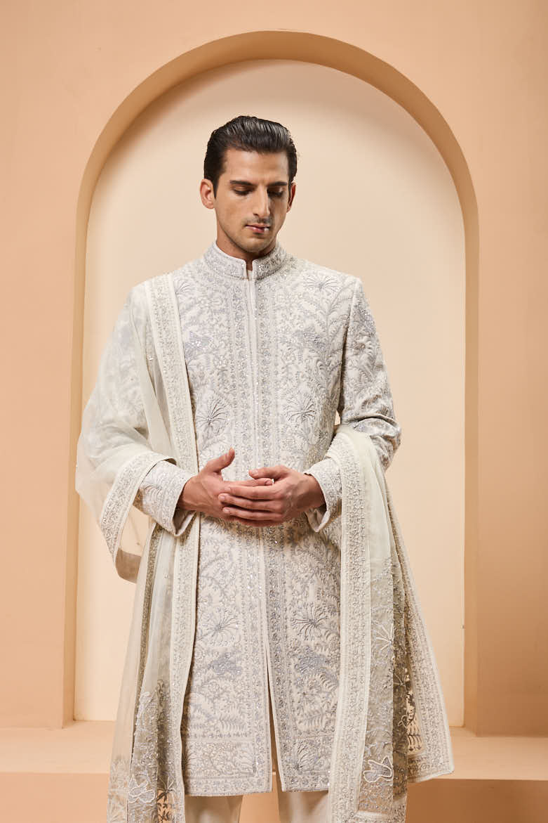 Ivory sherwani detailing with silver zari,pearl,sequins and thread work