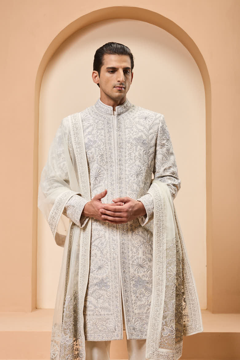 Ivory sherwani detailing with silver zari,pearl,sequins and thread work