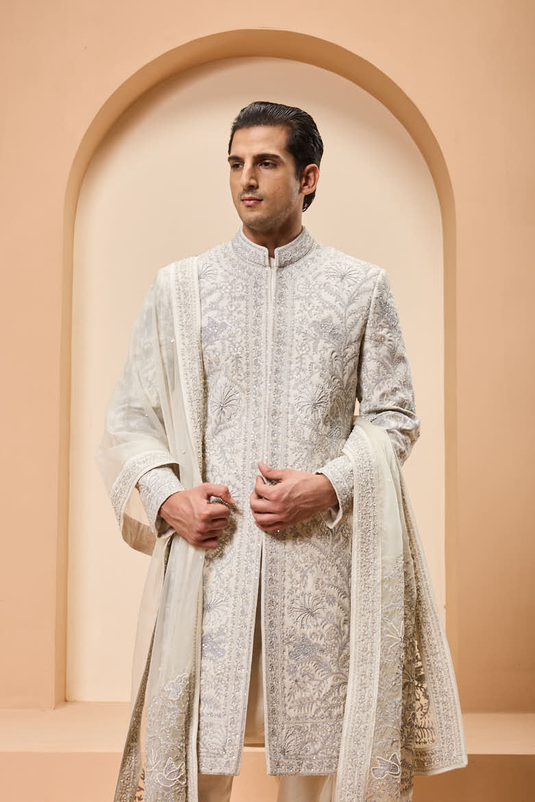 Ivory sherwani detailing with silver zari,pearl,sequins and thread work
