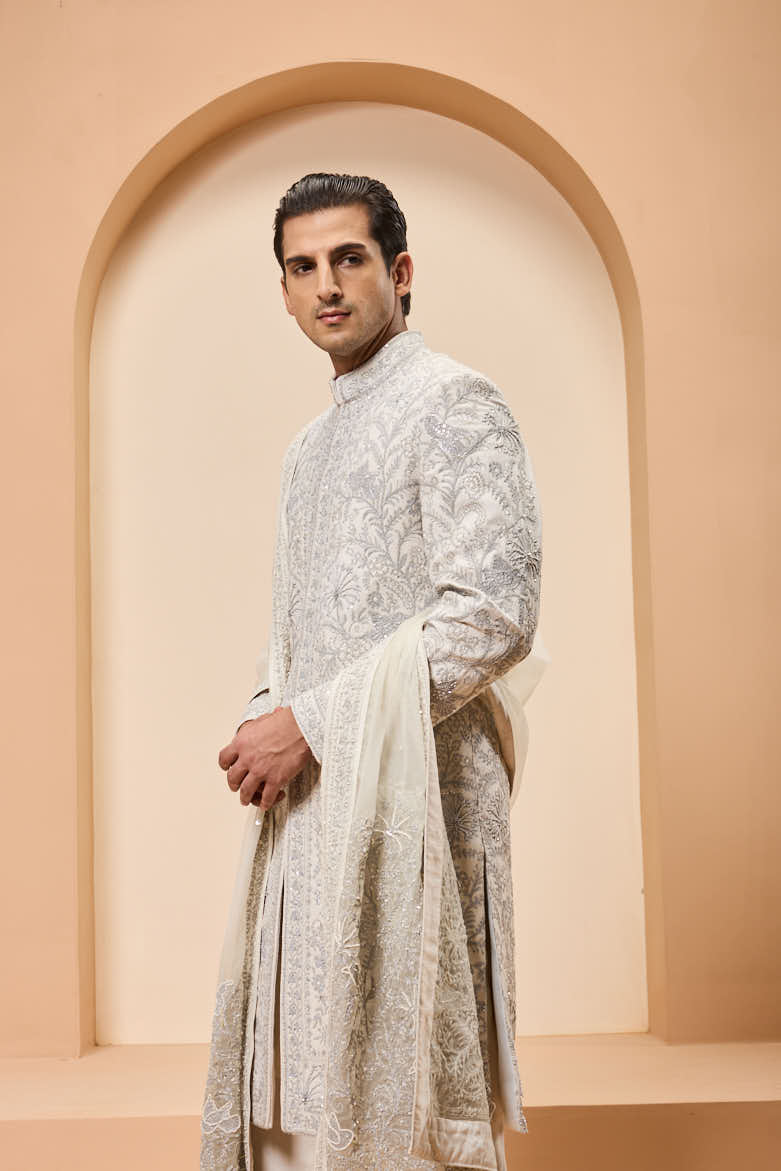 Ivory sherwani detailing with silver zari,pearl,sequins and thread work