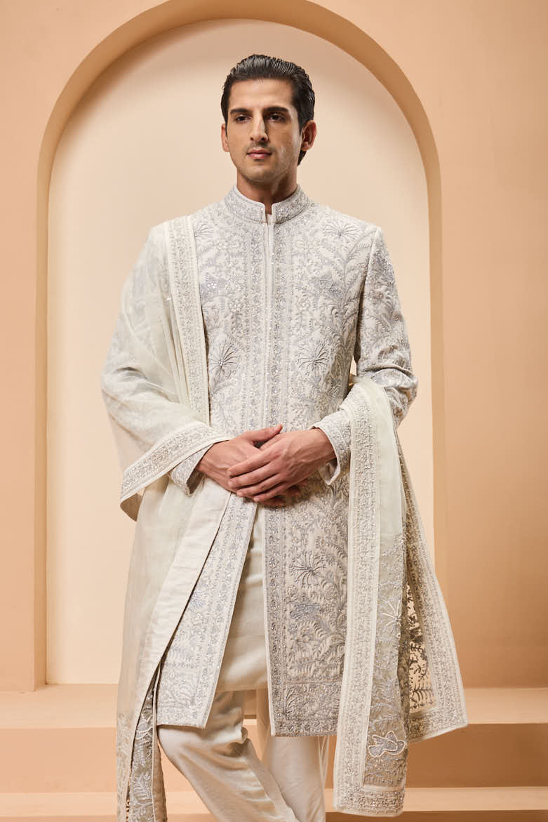 Ivory sherwani detailing with silver zari,pearl,sequins and thread work