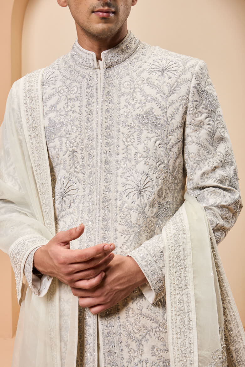 Ivory sherwani detailing with silver zari,pearl,sequins and thread work