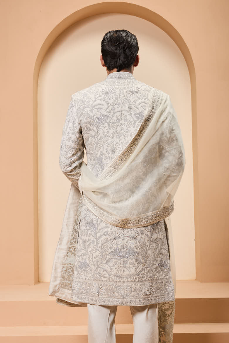 Ivory sherwani detailing with silver zari,pearl,sequins and thread work