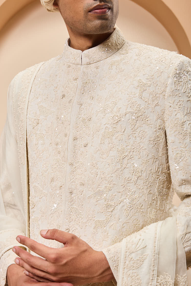Ivory sherwani detailing with pearl,sequins and thread work