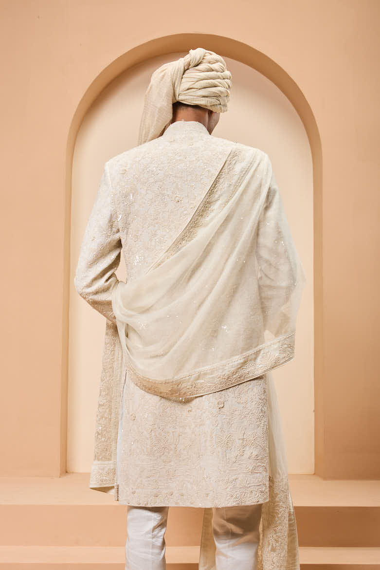 Ivory sherwani detailing with pearl,sequins and thread work