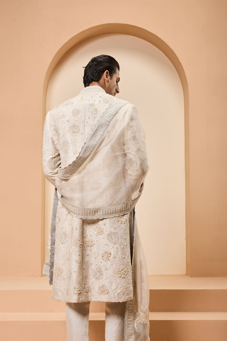 Ivory sherwani detailing with pearl,sequins and thread work