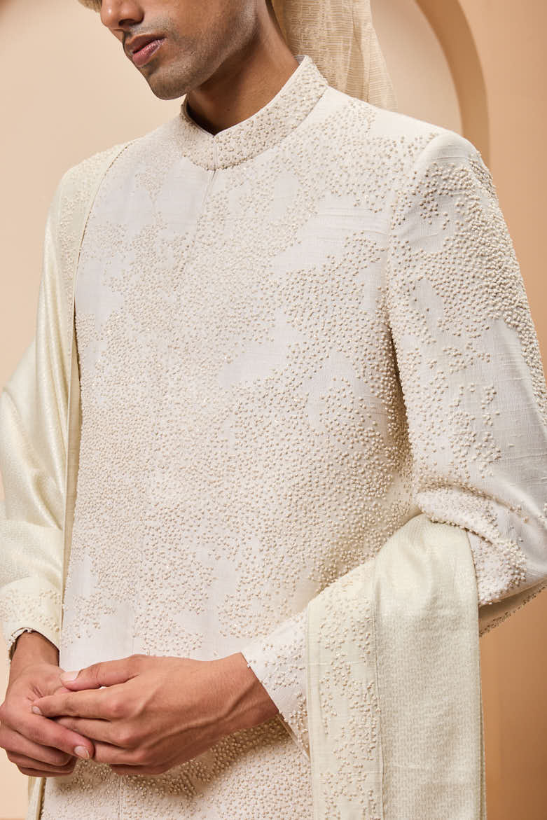 Ivory sherwani detailing with pearl,sequins and thread work