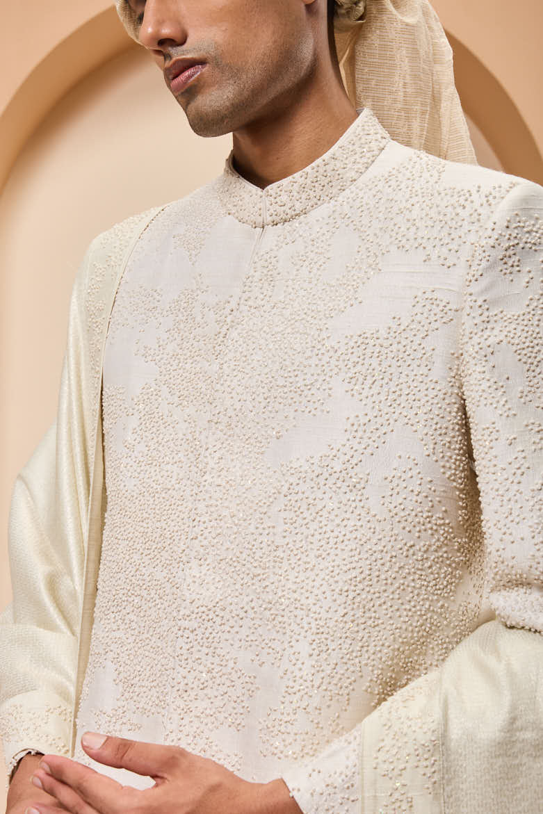 Ivory sherwani detailing with pearl,sequins and thread work
