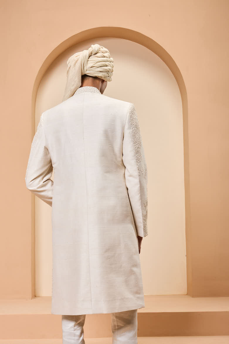 Ivory sherwani detailing with pearl,sequins and thread work