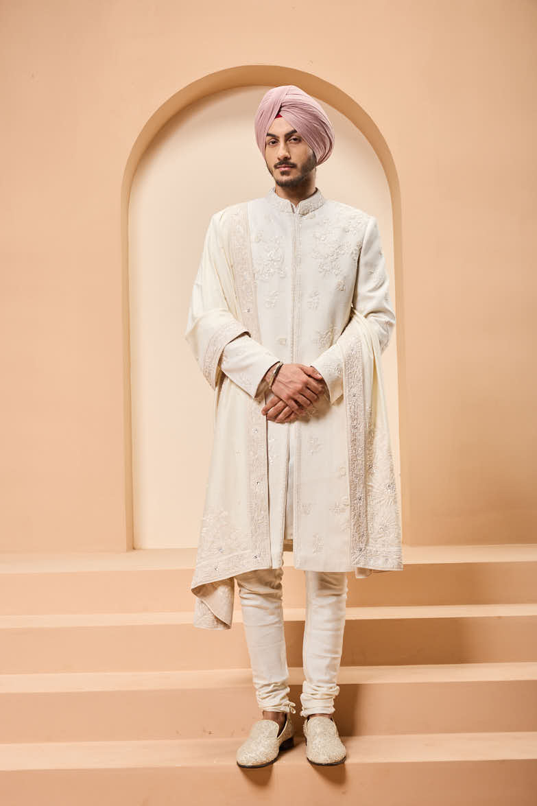 Ivory sherwani detailing with sequins and with thread work