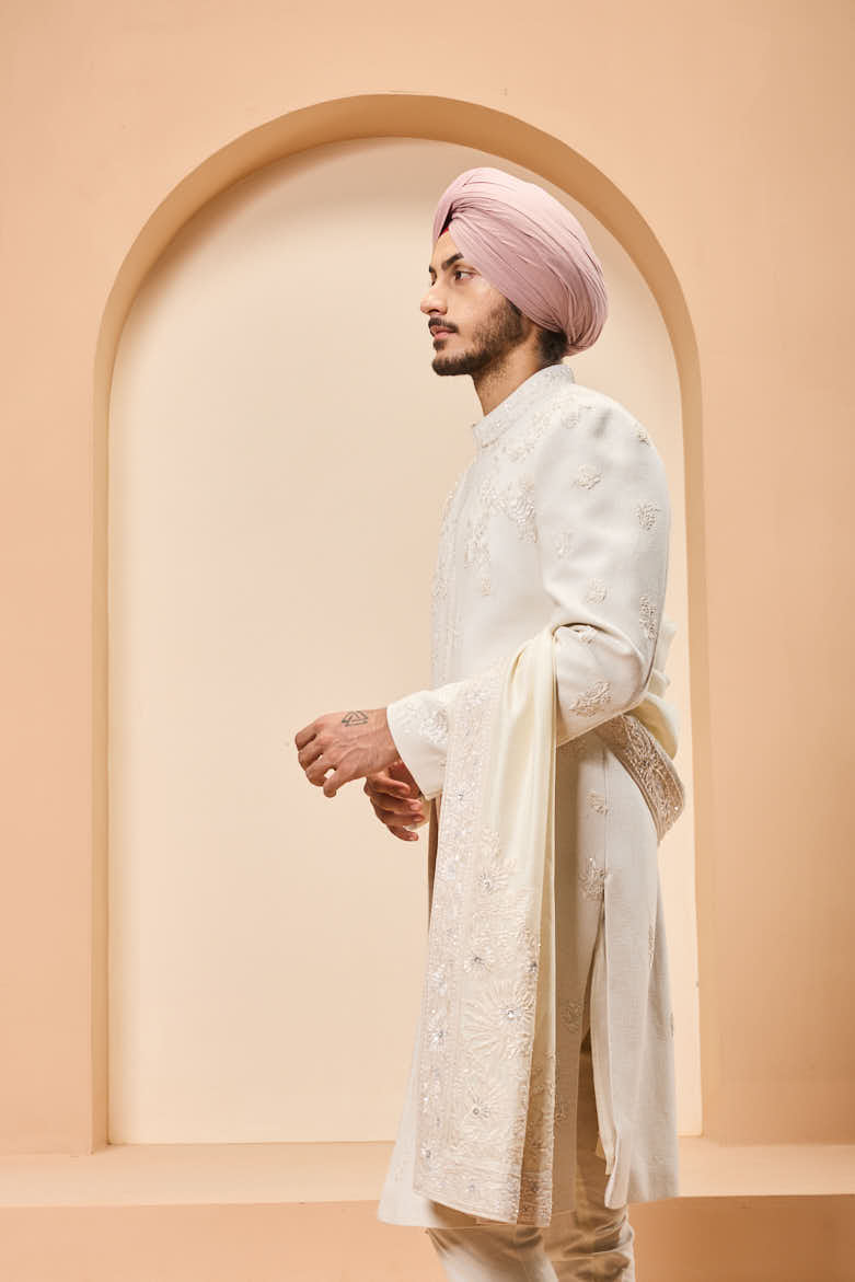 Ivory sherwani detailing with sequins and with thread work