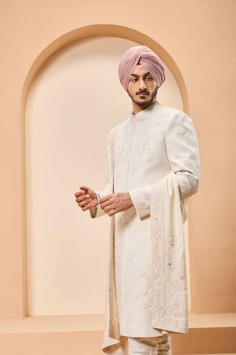 Ivory sherwani detailing with sequins and with thread work