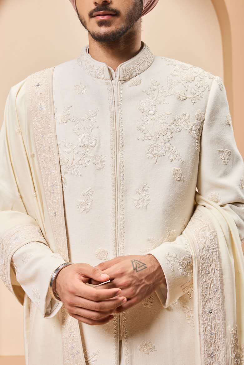 Ivory sherwani detailing with sequins and with thread work