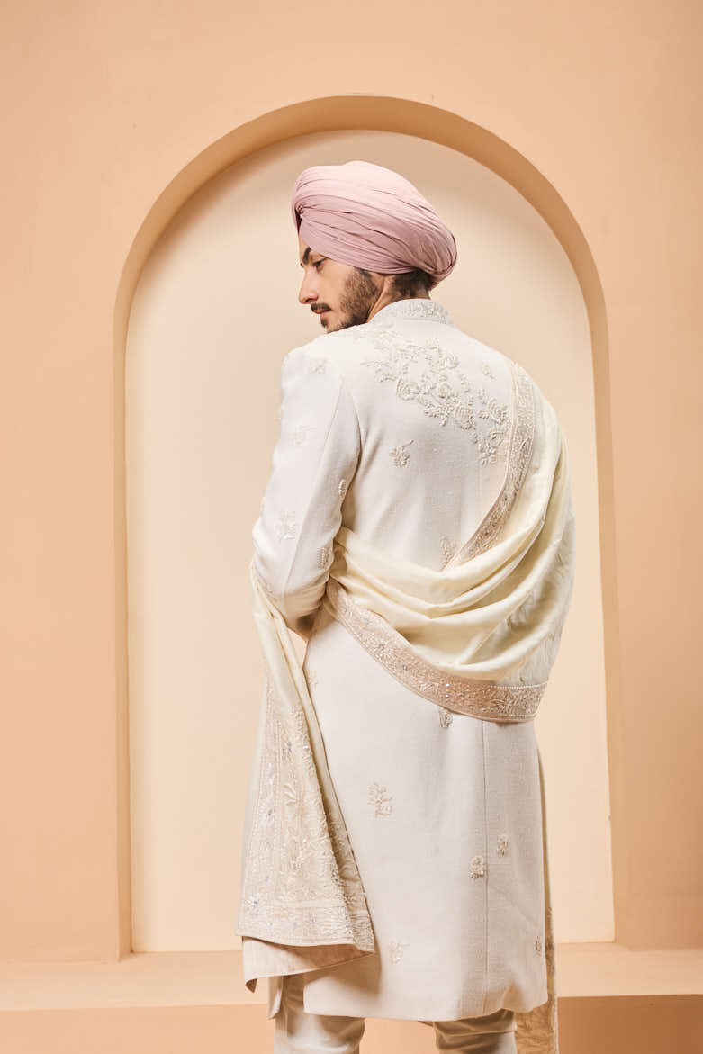 Ivory sherwani detailing with sequins and with thread work