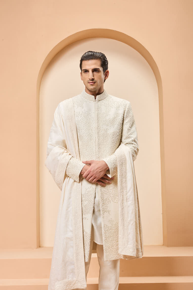 Ivory sherwani detailing with pearl,cutdana and thread work