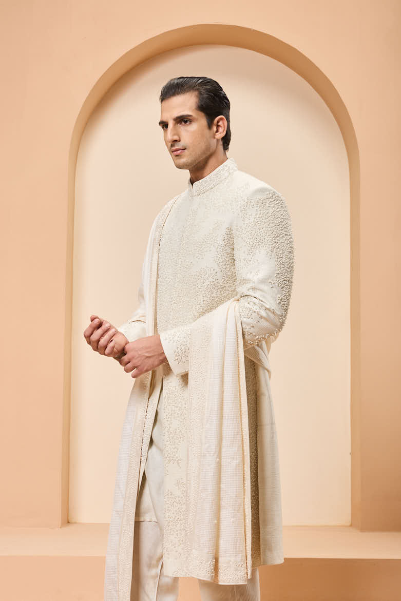 Ivory sherwani detailing with pearl,cutdana and thread work