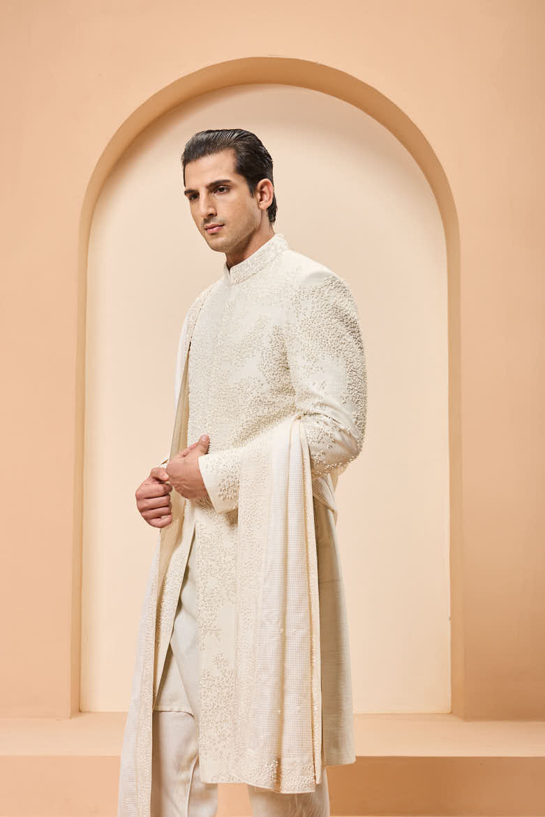 Ivory sherwani detailing with pearl,cutdana and thread work