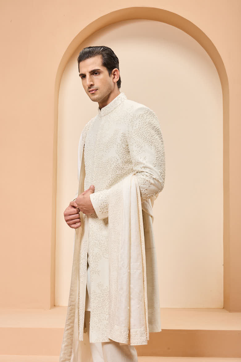 Ivory sherwani detailing with pearl,cutdana and thread work