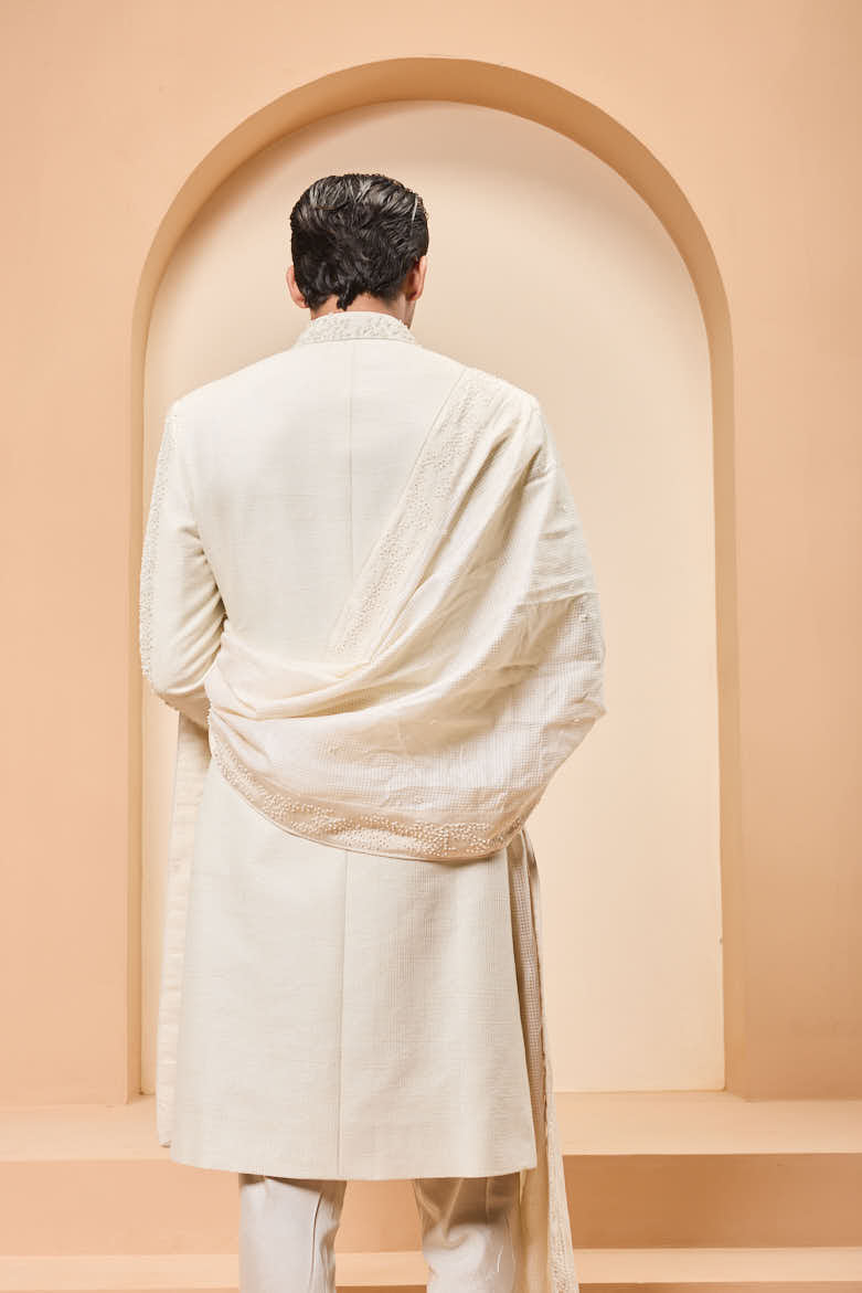 Ivory sherwani detailing with pearl,cutdana and thread work