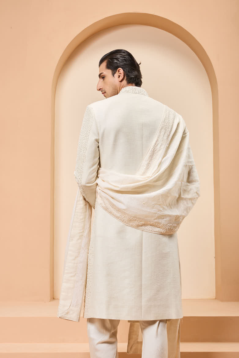 Ivory sherwani detailing with pearl,cutdana and thread work