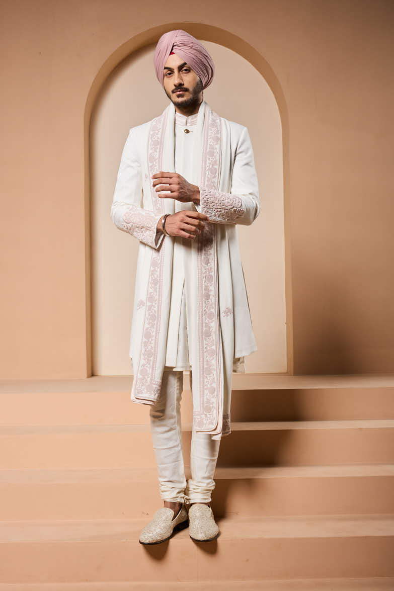 Ivory sherwani detailing with sequins and with thread work