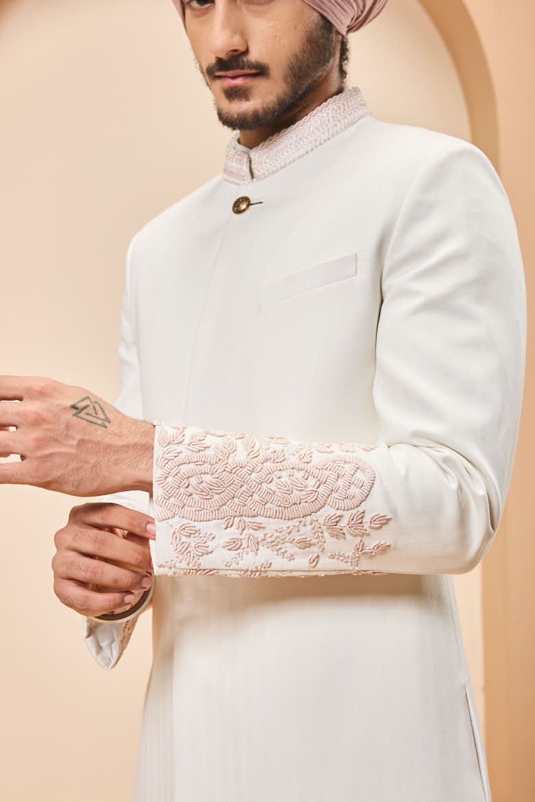 Ivory sherwani detailing with sequins and with thread work