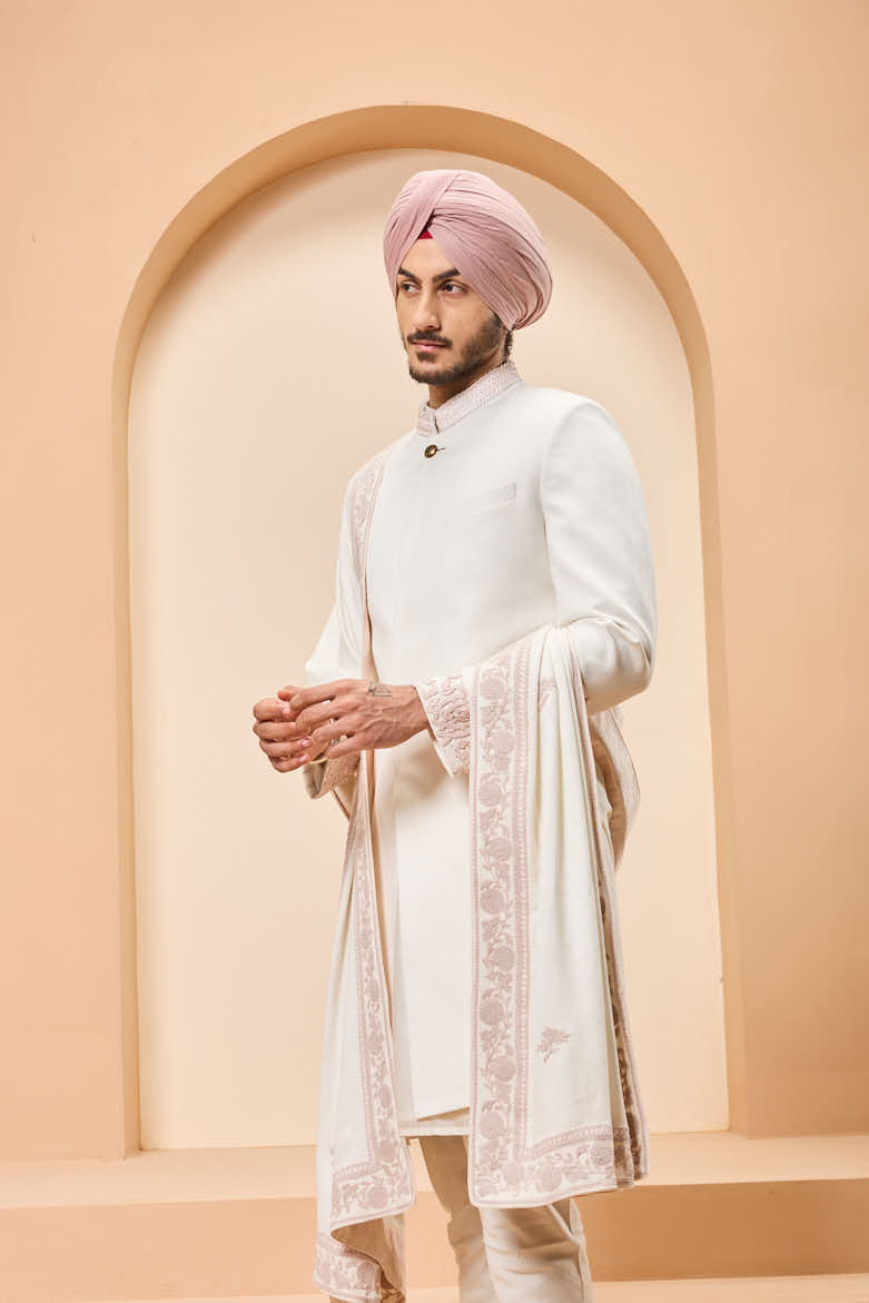 Ivory sherwani detailing with sequins and with thread work