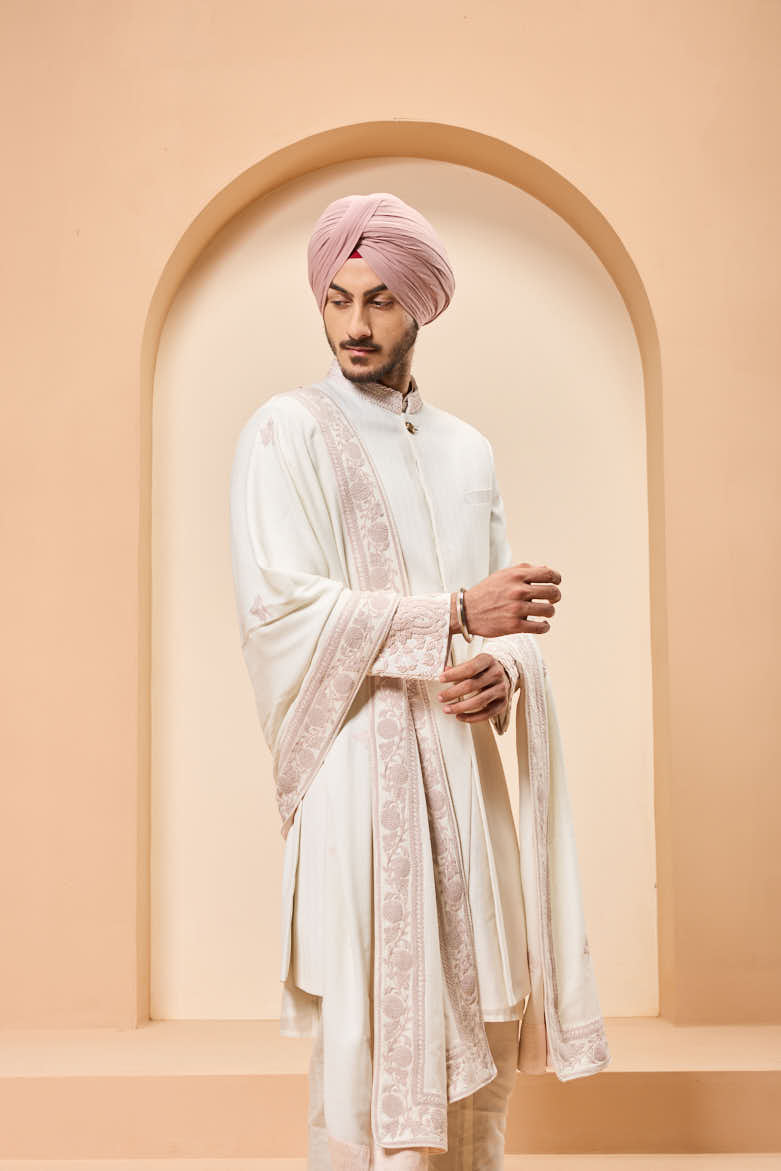 Ivory sherwani detailing with sequins and with thread work