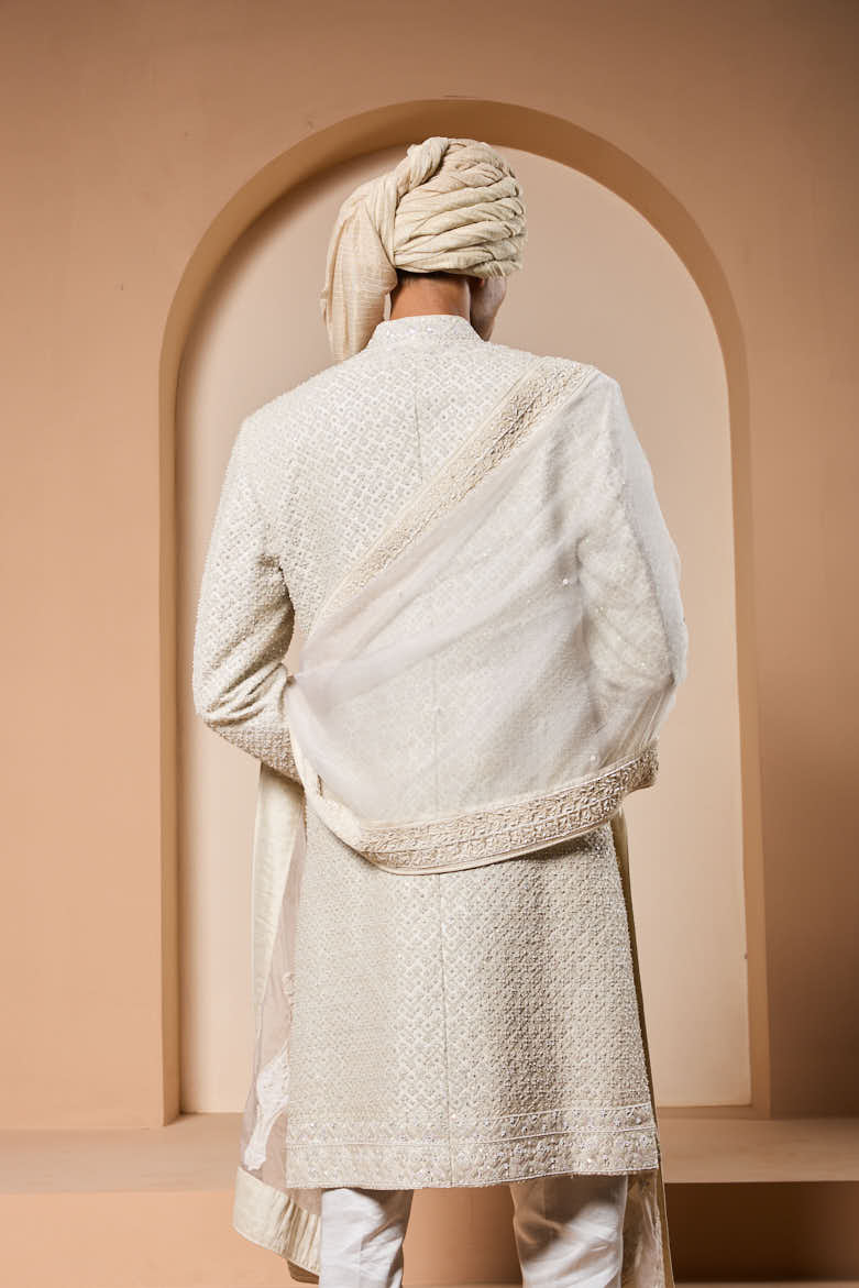 Ivory sherwani detailing with pearl, rainbow sequins and thread work