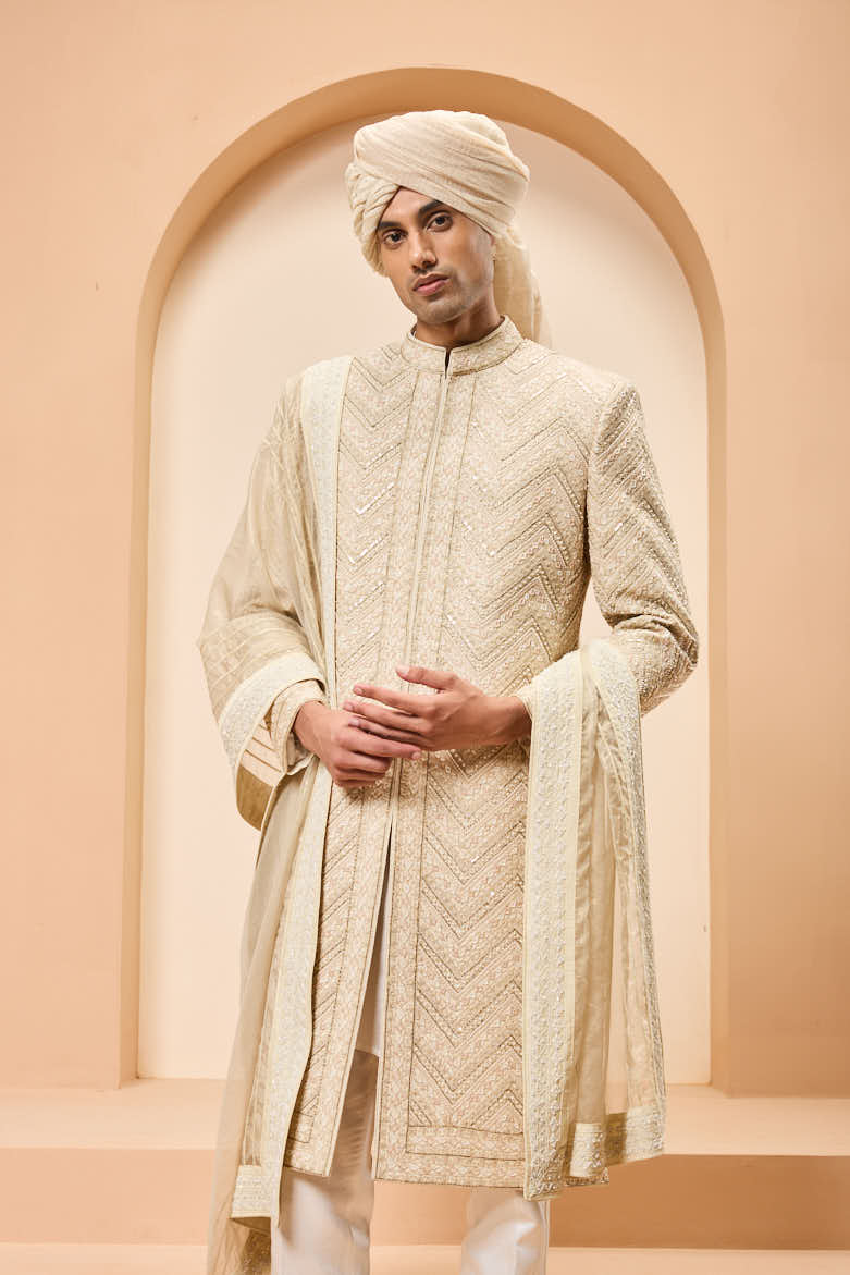 Ivory gold sherwani detailing with zardozi,pearl,sequins and thread work