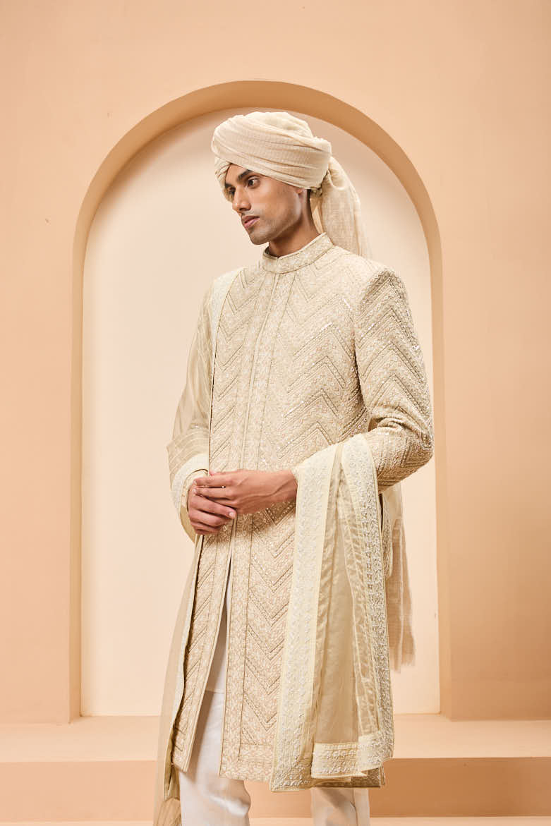 Ivory gold sherwani detailing with zardozi,pearl,sequins and thread work