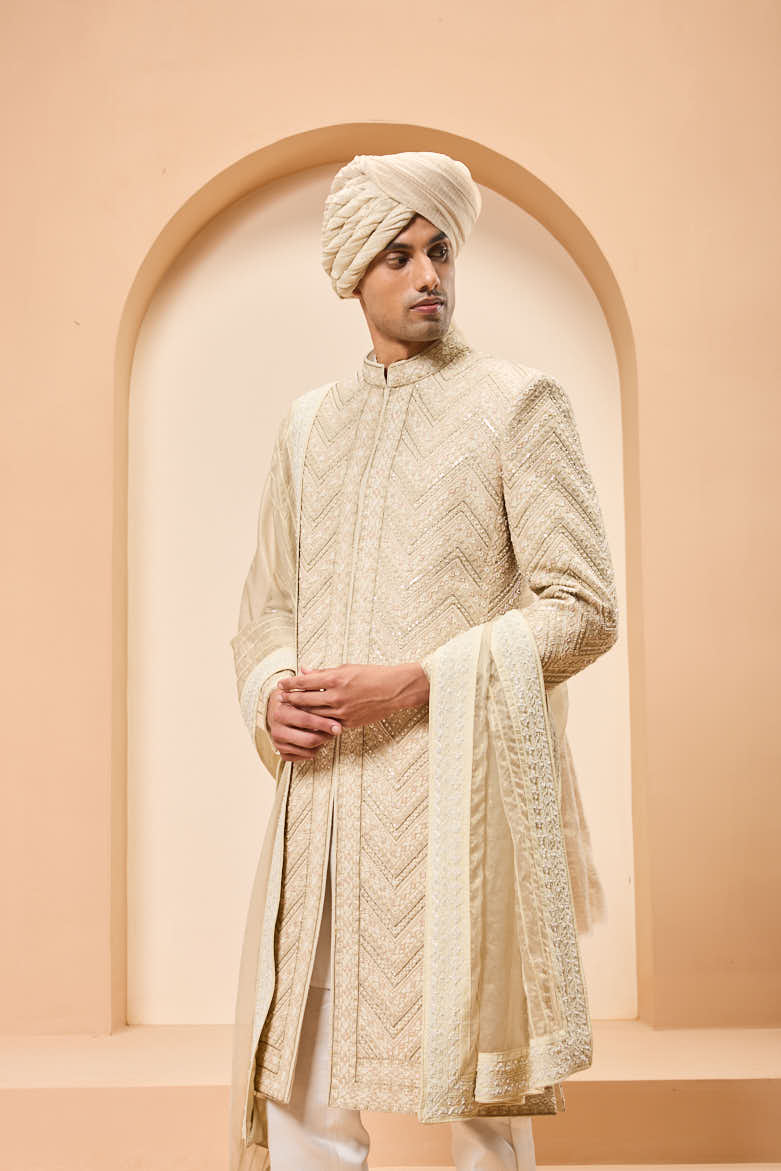 Ivory gold sherwani detailing with zardozi,pearl,sequins and thread work