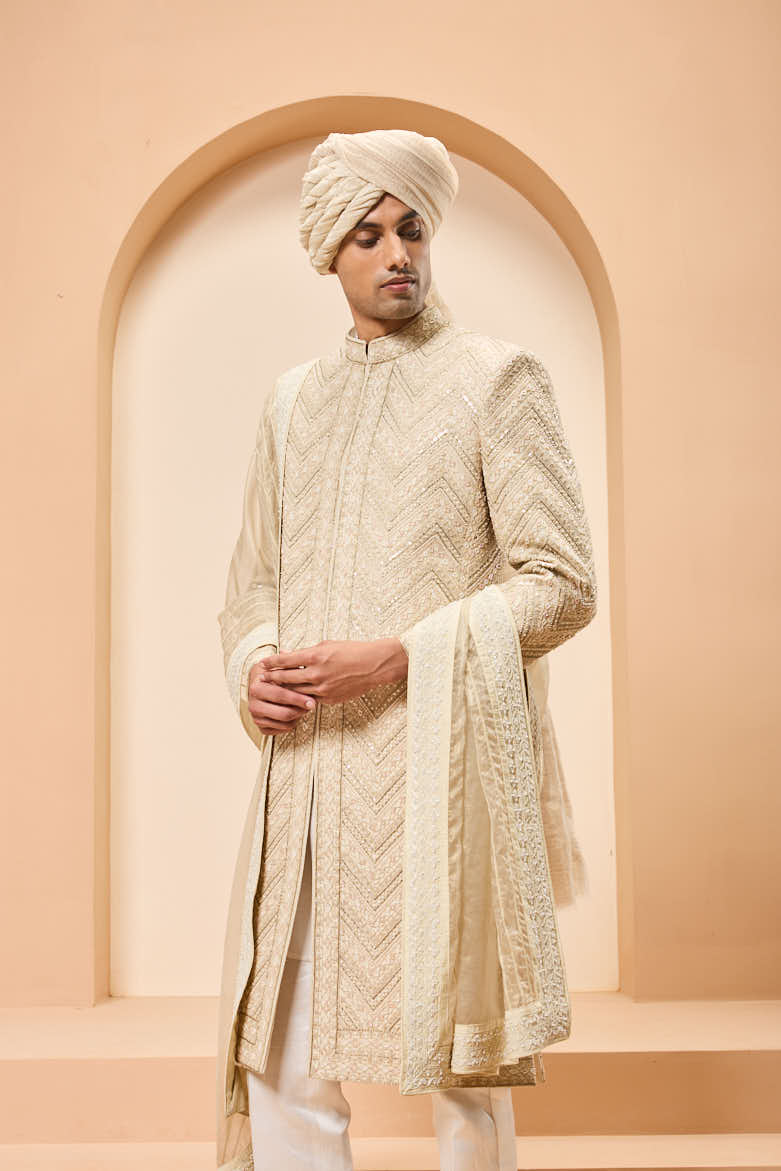 Ivory gold sherwani detailing with zardozi,pearl,sequins and thread work