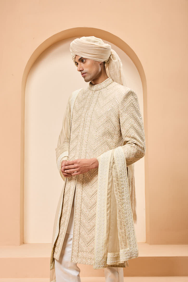 Ivory gold sherwani detailing with zardozi,pearl,sequins and thread work