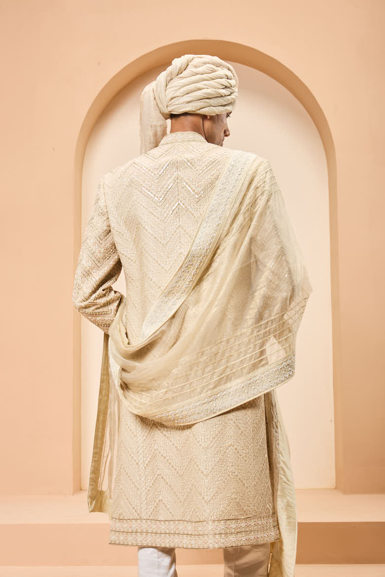 Ivory gold sherwani detailing with zardozi,pearl,sequins and thread work