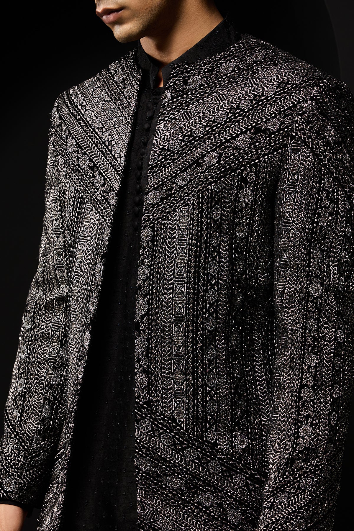 Black open bandhgala
with silver zari , sequins & pearl
work