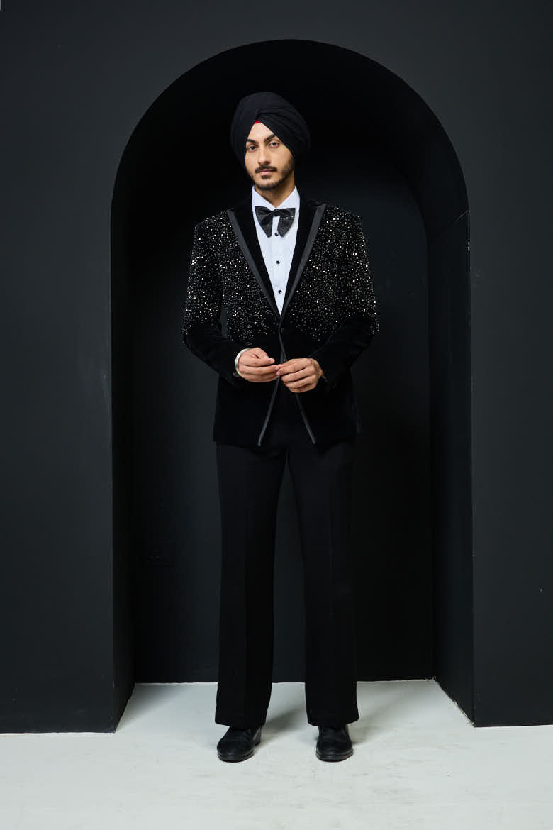 Black tuxedo highlighted with pearls and crystal