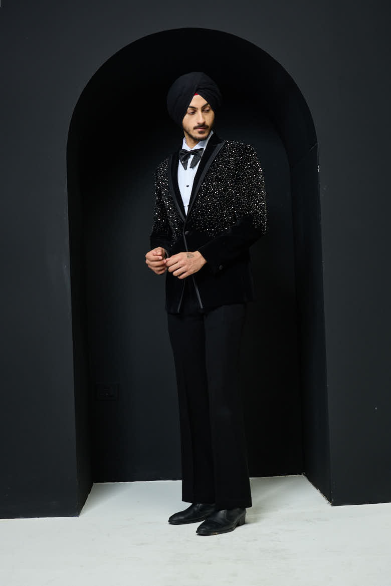 Black tuxedo highlighted with pearls and crystal