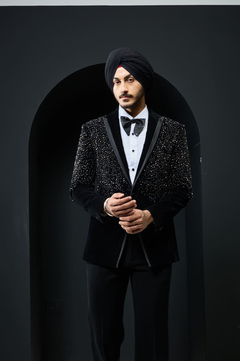 Black tuxedo highlighted with pearls and crystal