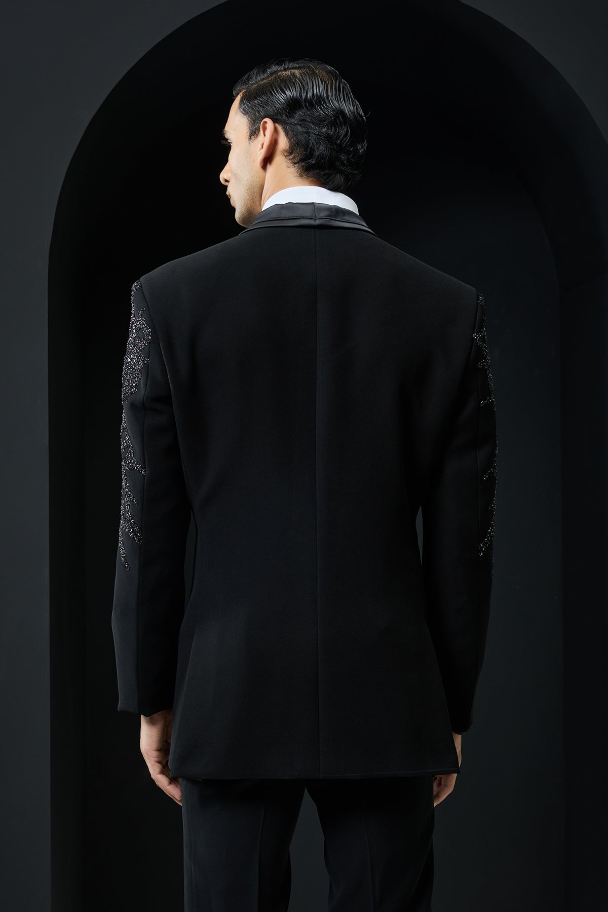 Black tuxedo highlighted with sequins, pearls,cutdana