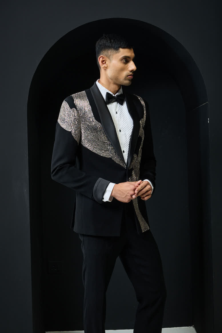 Black tuxedo highlighted with silver zari , cutdana and peals