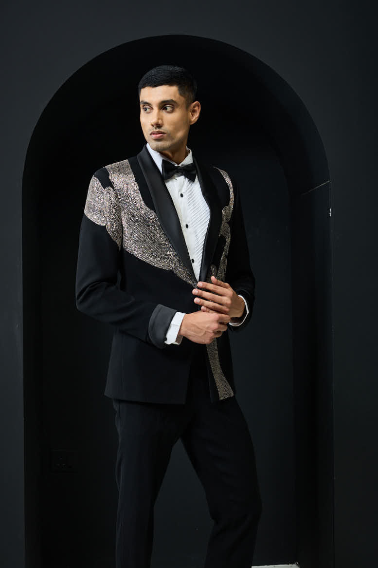 Black tuxedo highlighted with silver zari , cutdana and peals